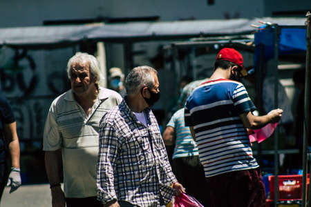 Limassol Cyprus May 09, 2020 View of an unidentified people with a face mask to protect themselves from the coronavirus shopping in the Limassol market in the morningのeditorial素材