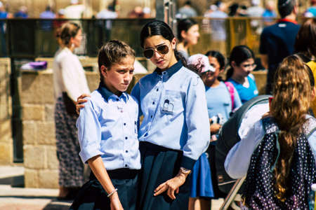 Jerusalem Israel October 06, 2019 View of unknowns Israeli young girls having fun front the Western wall in the Old city of Jerusalem in the afternoonのeditorial素材