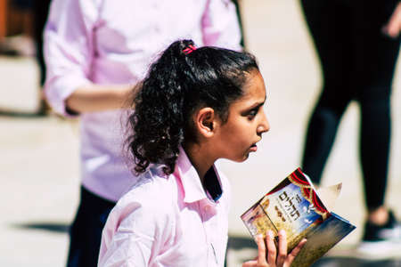 Jerusalem Israel October 06, 2019 View of unknowns Israeli young girls praying front the Western wall in the Old city of Jerusalem in the afternoonのeditorial素材