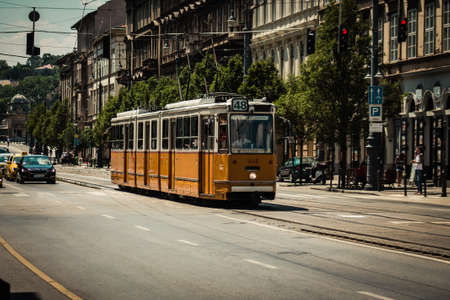Budapest Hungary july 11, 2020 View of a traditional Hungarian electric tram for passengers driving through the streets and part of the public transport system of Budapest, the capital of Hungaryのeditorial素材