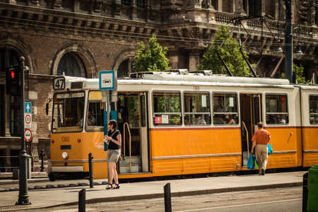 Budapest Hungary july 11, 2020 View of a traditional Hungarian electric tram for passengers driving through the streets and part of the public transport system of Budapest, the capital of Hungaryのeditorial素材