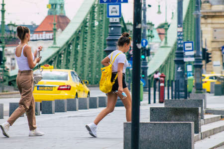 Budapest Hungary july 11, 2020 View of unidentified people with a bicycle in the historical streets of Budapest, the capital of Hungary and the ninth largest city in the European Union by populationのeditorial素材