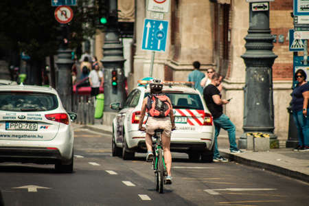 Budapest Hungary july 11, 2020 View of unidentified people with a bicycle in the historical streets of Budapest, the capital of Hungary and the ninth largest city in the European Union by populationのeditorial素材