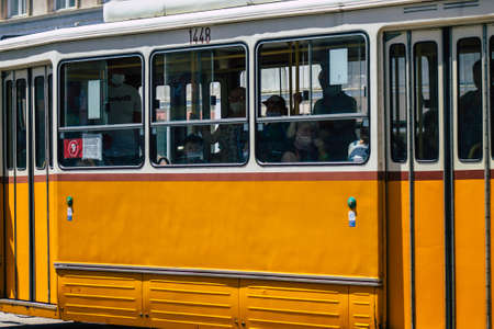 Budapest Hungary july 12, 2020 View of a traditional Hungarian electric tram for passengers driving through the streets and part of the public transport system of Budapest, the capital of Hungaryのeditorial素材