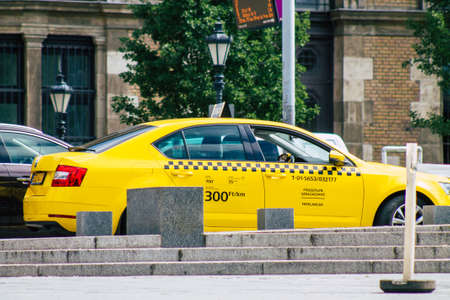 Budapest Hungary july 17, 2020 View of a traditional yellow Hungarian taxi for passengers driving through the streets of Budapest the capital of Hungaryのeditorial素材