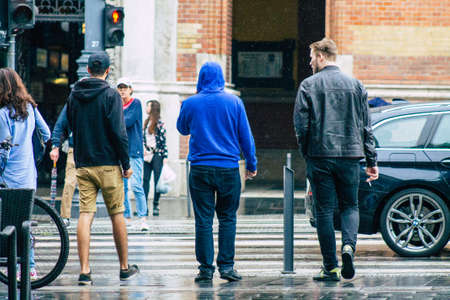 Budapest Hungary july 17, 2020 View of unidentified pedestrians walking under the rain in the...
