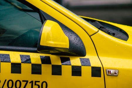 Budapest Hungary july 17, 2020 View of a traditional yellow Hungarian taxi for passengers driving through the streets of Budapest the capital of Hungaryのeditorial素材