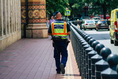 Budapest Hungary july 15, 2020 View of unidentified Hungarian police officer walking in the streets...