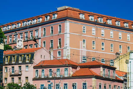 Lisbon Portugal july 24, 2020 View of classic facade of ancient historical buildings in the downtown area of Lisbon, the hilly coastal capital city of Portugal and one of the oldest cities in Europeの写真素材