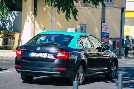 Lisbon Portugal july 24, 2020 View of a taxi for passengers driving through the streets of Lisbon, the hilly coastal capital city of Portugal and one of the stunning oldest cities in Europeのeditorial素材
