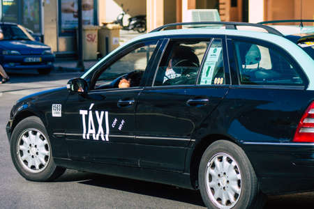 Lisbon Portugal july 24, 2020 View of a taxi for passengers driving through the streets of Lisbon, the hilly coastal capital city of Portugal and one of the stunning oldest cities in Europeのeditorial素材