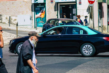 Lisbon Portugal july 24, 2020 View of a taxi for passengers driving through the streets of Lisbon, the hilly coastal capital city of Portugal and one of the stunning oldest cities in Europeのeditorial素材