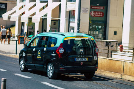 Lisbon Portugal july 24, 2020 View of a taxi for passengers driving through the streets of Lisbon, the hilly coastal capital city of Portugal and one of the stunning oldest cities in Europeのeditorial素材