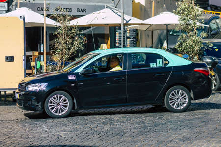 Lisbon Portugal july 24, 2020 View of a taxi for passengers driving through the streets of Lisbon, the hilly coastal capital city of Portugal and one of the stunning oldest cities in Europeのeditorial素材