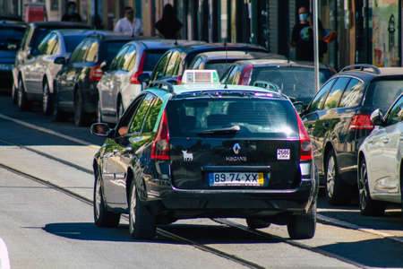Lisbon Portugal july 24, 2020 View of a taxi for passengers driving through the streets of Lisbon, the hilly coastal capital city of Portugal and one of the stunning oldest cities in Europeのeditorial素材