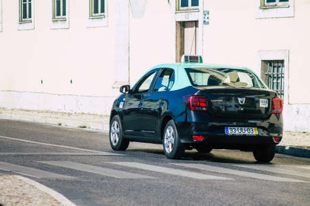 Lisbon Portugal july 24, 2020 View of a taxi for passengers driving through the streets of Lisbon, the hilly coastal capital city of Portugal and one of the stunning oldest cities in Europeのeditorial素材