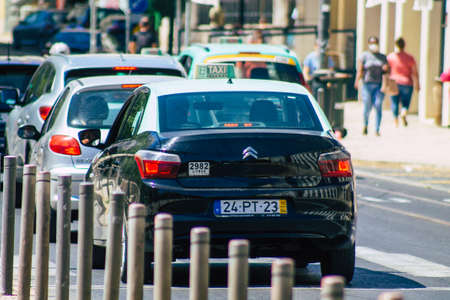 Lisbon Portugal july 24, 2020 View of a taxi for passengers driving through the streets of Lisbon, the hilly coastal capital city of Portugal and one of the stunning oldest cities in Europeのeditorial素材