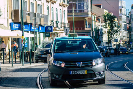 Lisbon Portugal july 24, 2020 View of a taxi for passengers driving through the streets of Lisbon, the hilly coastal capital city of Portugal and one of the stunning oldest cities in Europeのeditorial素材