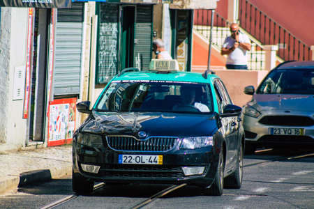 Lisbon Portugal july 24, 2020 View of a taxi for passengers driving through the streets of Lisbon, the hilly coastal capital city of Portugal and one of the stunning oldest cities in Europeのeditorial素材