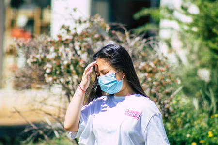 Lisbon Portugal july 24, 2020 View of unidentified pedestrians with a face to protect themself from the coronavirus walking in the historical streets of Lisbon, the coastal capital city of Portugalのeditorial素材