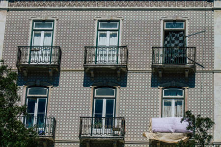 Lisbon Portugal july 25, 2020 View of classic facade of ancient historical buildings in the downtown area of Lisbon, the hilly coastal capital city of Portugal and one of the oldest cities in Europeの写真素材