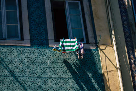 Lisbon Portugal july 25, 2020 View of classic facade of ancient historical buildings in the downtown area of Lisbon, the hilly coastal capital city of Portugal and one of the oldest cities in Europeの写真素材