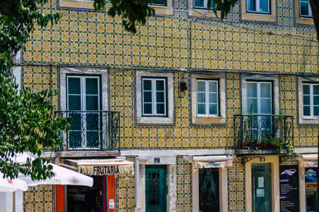 Lisbon Portugal july 26, 2020 View of classic facade of ancient historical buildings in the downtown area of Lisbon, the hilly coastal capital city of Portugal and one of the oldest cities in Europeの写真素材