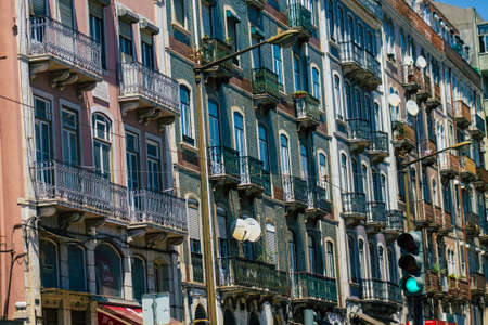 Lisbon Portugal july 26, 2020 View of classic facade of ancient historical buildings in the downtown area of Lisbon, the hilly coastal capital city of Portugal and one of the oldest cities in Europeの写真素材