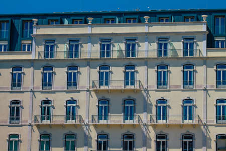 Lisbon Portugal july 26, 2020 View of classic facade of ancient historical buildings in the downtown area of Lisbon, the hilly coastal capital city of Portugal and one of the oldest cities in Europeの写真素材