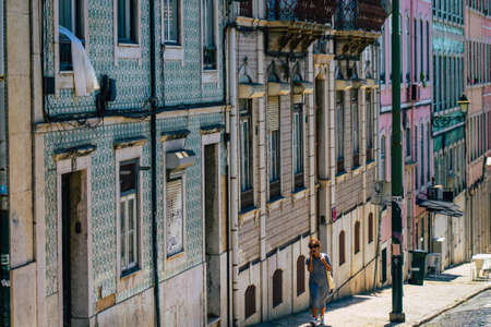 Lisbon Portugal july 26, 2020 View of classic facade of ancient historical buildings in the downtown area of Lisbon, the hilly coastal capital city of Portugal and one of the oldest cities in Europeの写真素材