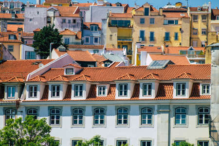 Lisbon Portugal july 26, 2020 View of classic facade of ancient historical buildings in the downtown area of Lisbon, the hilly coastal capital city of Portugal and one of the oldest cities in Europeの写真素材