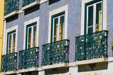 Lisbon Portugal july 29, 2020 View of classic facade of ancient historical buildings in the downtown area of Lisbon, the hilly coastal capital city of Portugal and one of the oldest cities in Europeの写真素材