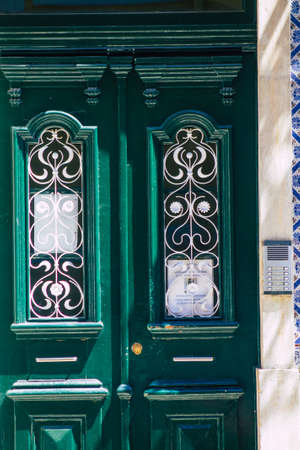 Lisbon Portugal july 30, 2020 View of a door on the facade of ancient historical buildings in the...