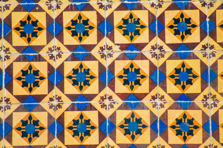 View of mosaic on the facade of ancient historical buildings in the downtown area of Lisbon, the...