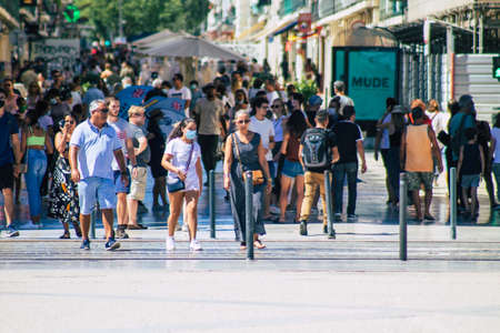 Lisbon Portugal August 01, 2020 View of unidentified pedestrians walking in the streets of the downtown area of Lisbon, the hilly coastal capital city of Portugal and one of the oldest cities in Europeの写真素材