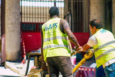 Lisbon Portugal August 01, 2020 View of unidentified workers in the streets of the downtown area of Lisbon, the hilly coastal capital city of Portugal and one of the oldest cities in Europeの写真素材