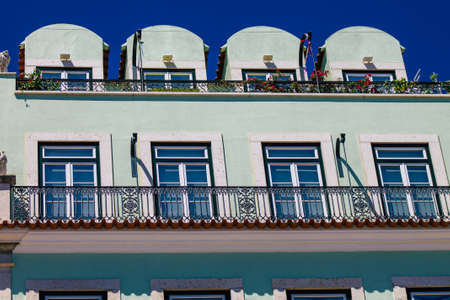 Lisbon Portugal August 01, 2020 View of classic facade of ancient historical buildings in the downtown area of Lisbon, the hilly coastal capital city of Portugal and one of the oldest cities in Europeのeditorial素材