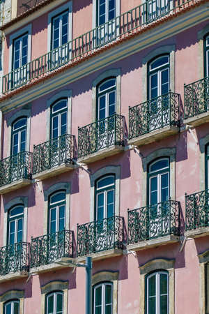 Lisbon Portugal August 01, 2020 View of classic facade of ancient historical buildings in the downtown area of Lisbon, the hilly coastal capital city of Portugal and one of the oldest cities in Europeのeditorial素材