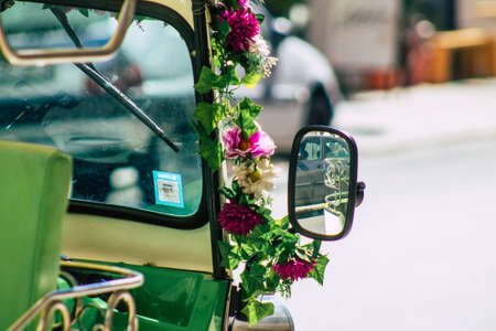 Lisbon Portugal August 01, 2020 View of a tuk tuk for tourists driving through the streets of Lisbon, the hilly coastal capital city of Portugal and one of the oldest cities in Europeのeditorial素材