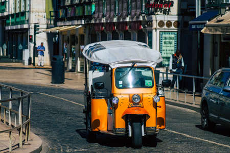 Lisbon Portugal August 01, 2020 View of a tuk tuk for tourists driving through the streets of Lisbon, the hilly coastal capital city of Portugal and one of the oldest cities in Europeのeditorial素材