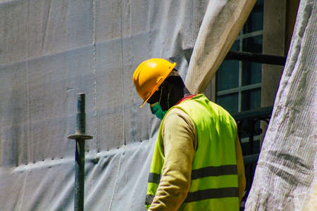 Lisbon Portugal August 01, 2020 View of unidentified workers in the streets of the downtown area of...