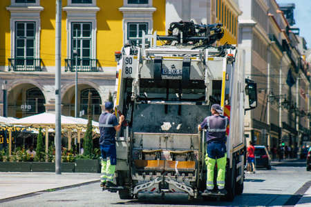 Lisbon Portugal August 04, 2020 View of a garbage truck rolling in the downtown area of Lisbon, the hilly coastal capital city of Portugal and one of the oldest cities in Europeのeditorial素材