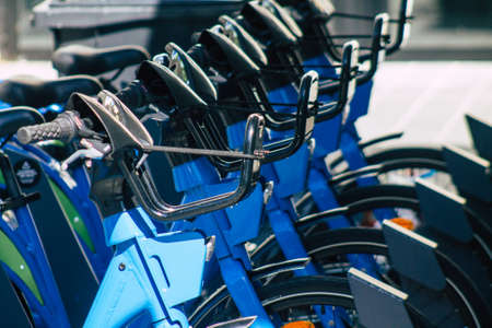 Reims France August 06, 2020 View of accessible bicycles to hire for short periods of time, usually for a few hours parked in the historical street and part of the public transport system of Reimsのeditorial素材