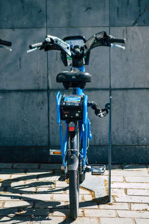 Reims France August 06, 2020 View of accessible bicycles to hire for short periods of time, usually for a few hours parked in the historical street and part of the public transport system of Reimsのeditorial素材
