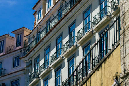Lisbon Portugal August 03, 2020 View of classic facade of ancient historical buildings in the downtown area of Lisbon, the hilly coastal capital city of Portugal and one of the oldest cities in Europeのeditorial素材