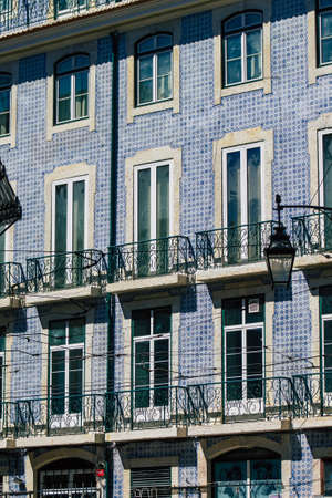 Lisbon Portugal August 03, 2020 View of classic facade of ancient historical buildings in the downtown area of Lisbon, the hilly coastal capital city of Portugal and one of the oldest cities in Europeのeditorial素材