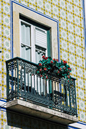 Lisbon Portugal August 03, 2020 View of classic facade of ancient historical buildings in the downtown area of Lisbon, the hilly coastal capital city of Portugal and one of the oldest cities in Europeのeditorial素材