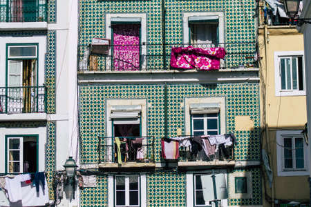 Lisbon Portugal August 03, 2020 View of classic facade of ancient historical buildings in the downtown area of Lisbon, the hilly coastal capital city of Portugal and one of the oldest cities in Europeのeditorial素材
