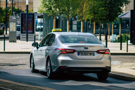 Reims France August 20, 2020 View of a traditional taxi for passengers driving through the historical streets of Reims, a city in the Grand Est region of France and one of the oldest in Europeのeditorial素材