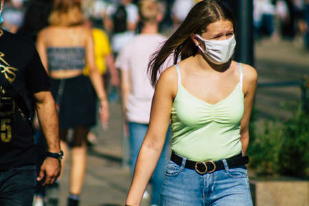 Reims France September 04, 2020 View of unidentified pedestrians with a face mask to protect themself from the coronavirus walking in the streets of Reims, a city in the Grand Est region of Franceのeditorial素材
